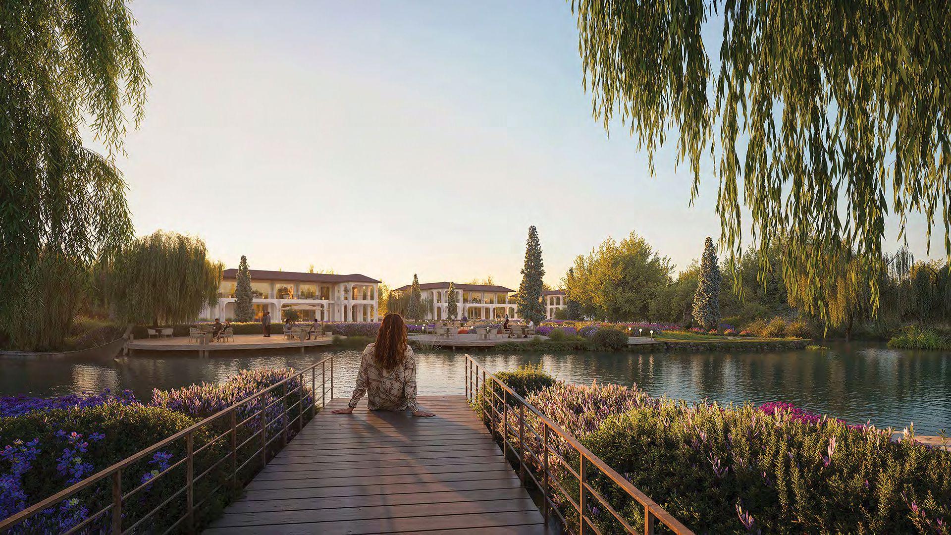 Aerial view of Tbilisi Waterfront in Krtsanisi Tbilisi featuring luxury villas, Eden Townhouses, lush greenery, and the Kura Riverfront.